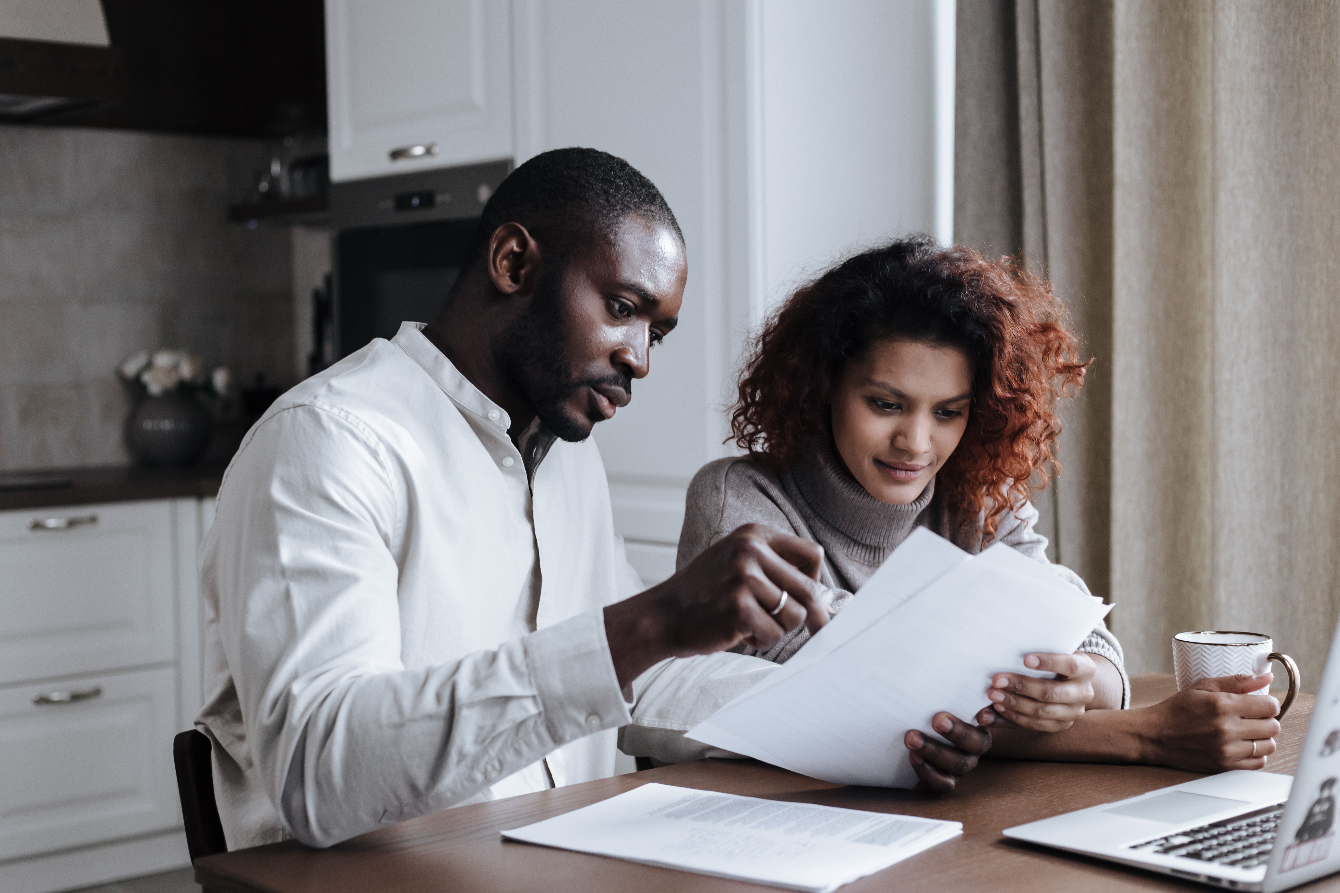 Homeowner reviewing HELOC rate offers on a laptop at home, 2026