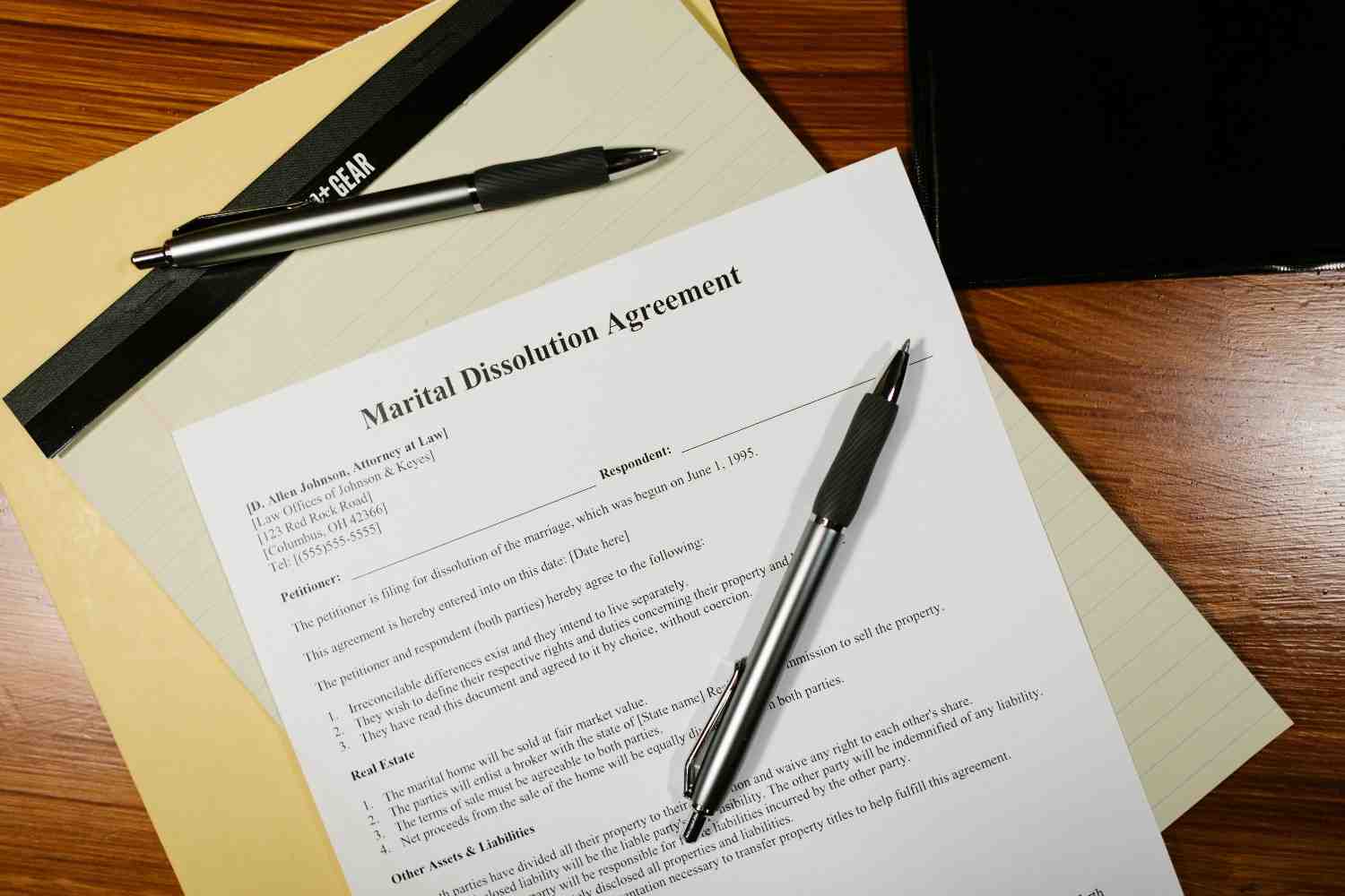 A high-end fountain pen resting on a signed professional service contract with a blurred corporate office background.